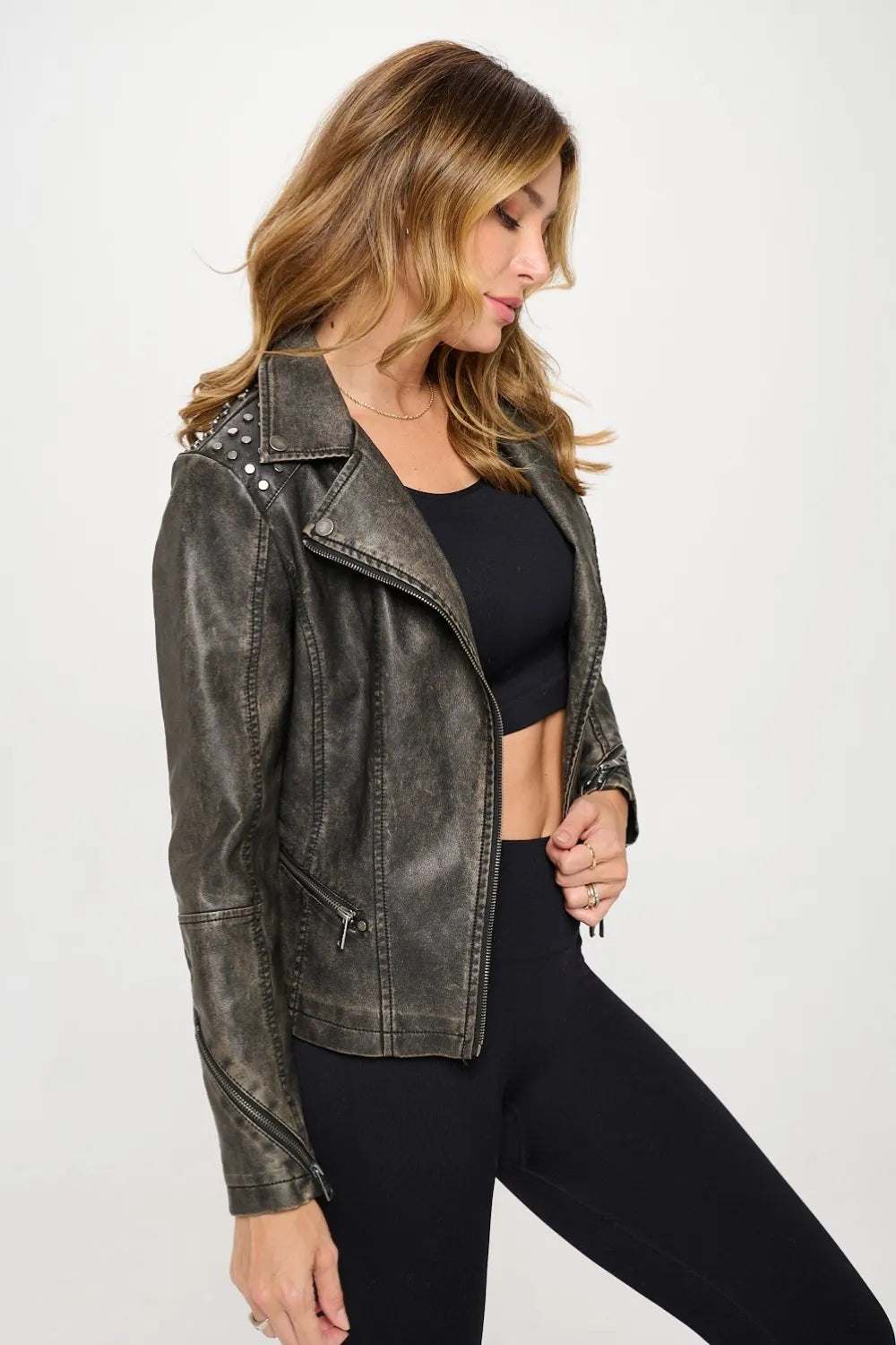 Black Coalition LA Studded Classic Moto Faux Leather Jacket with silver stud accents, featuring a fitted design and zipper details.