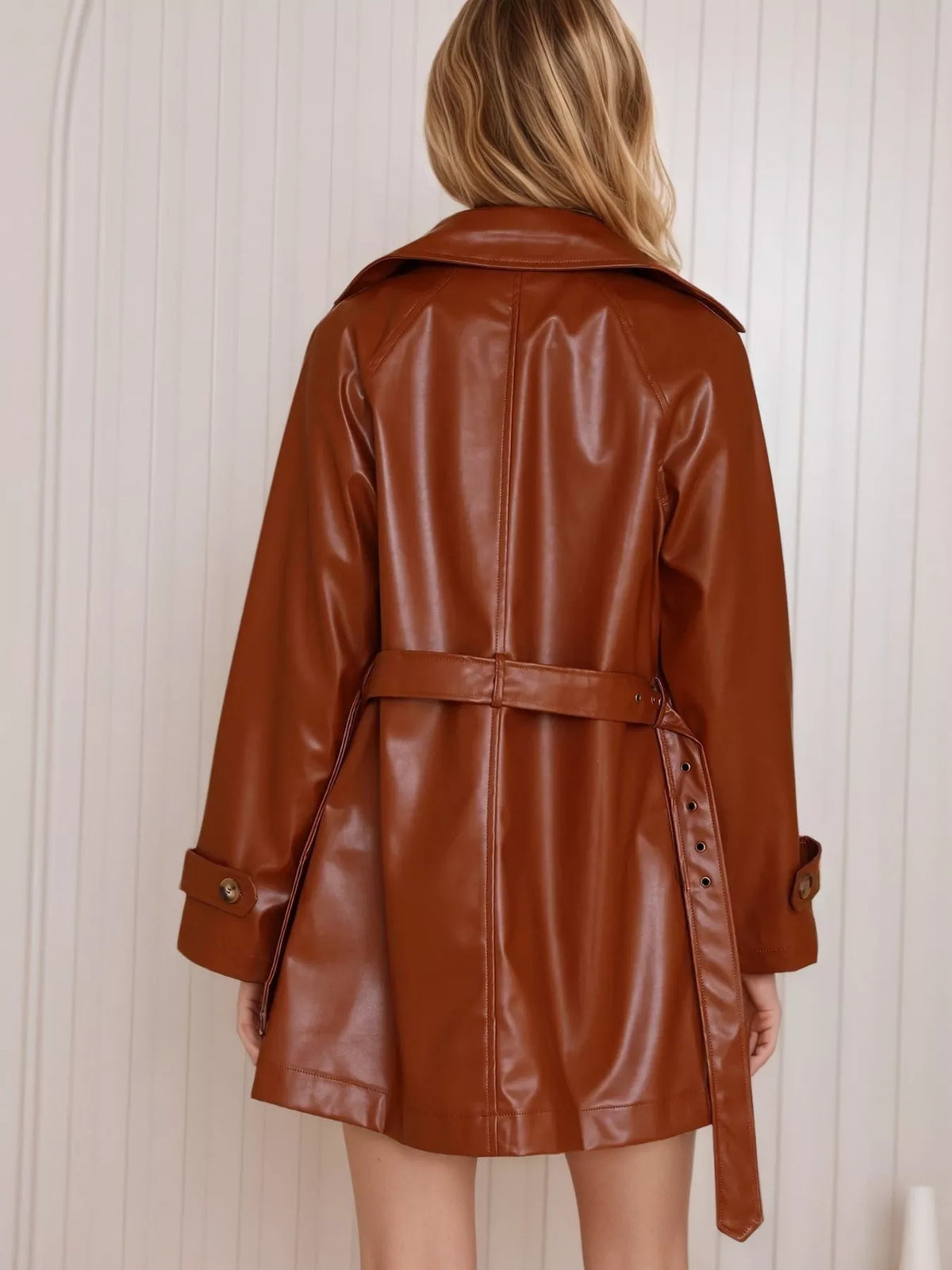 Leather double-breasted jacket from Trendsi featuring a classic design, with visible lapels and button details.