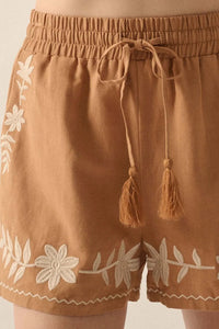 Embroidered boho casual shorts with tasseled drawstring and elastic waist in caramel color, featuring intricate embroidery details.