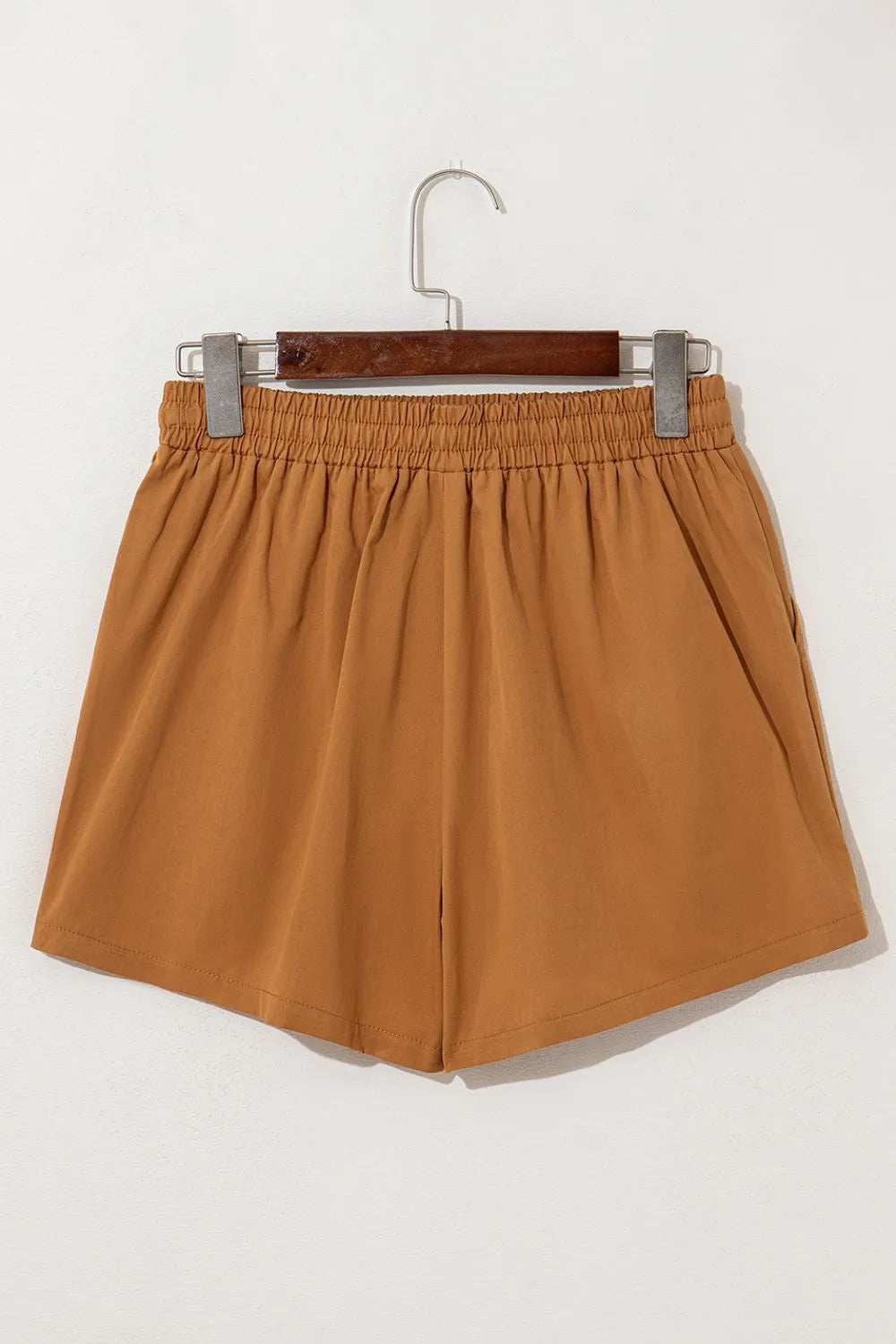 Caramel embroidered boho casual shorts with tasseled drawstring and elastic waist, stylish and comfortable for relaxed summer wear.