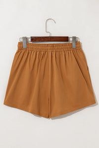 Caramel embroidered boho casual shorts with tasseled drawstring and elastic waist, stylish and comfortable for relaxed summer wear.