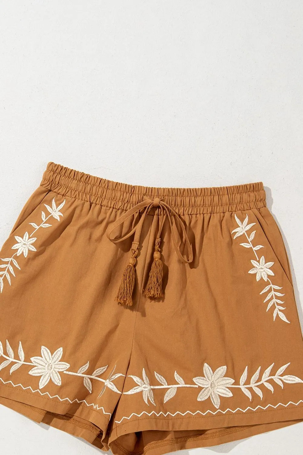 Caramel embroidered boho casual shorts with tasseled drawstring, elastic waist and relaxed fit, perfect for laid-back summer style.
