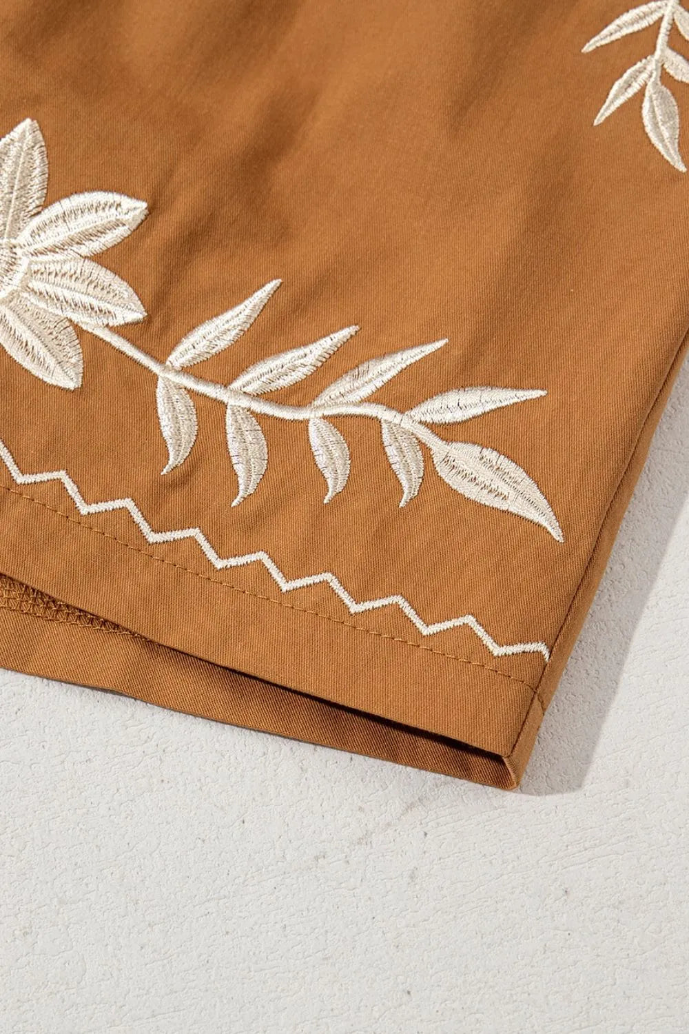 Caramel embroidered boho casual shorts with tasseled drawstring and elastic waistband, perfect for relaxed summer style.