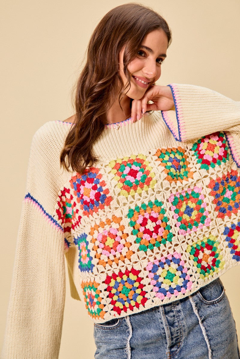 Multi-color granny crochet lace sweater top by Trendsi, featuring intricate crochet patterns and a cozy, stylish design.