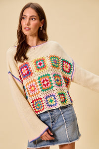 Multi-color granny crochet lace sweater top from Trendsi featuring a stylish, colorful knit design and intricate lace detailing.
