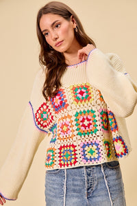 Multi-color granny crochet lace sweater top by Trendsi featuring intricate crochet patterns and a relaxed fit.
