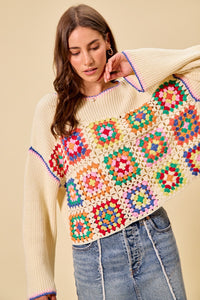 Multi-color granny crochet lace sweater top by Trendsi, featuring intricate lace details and a cozy, stylish design.