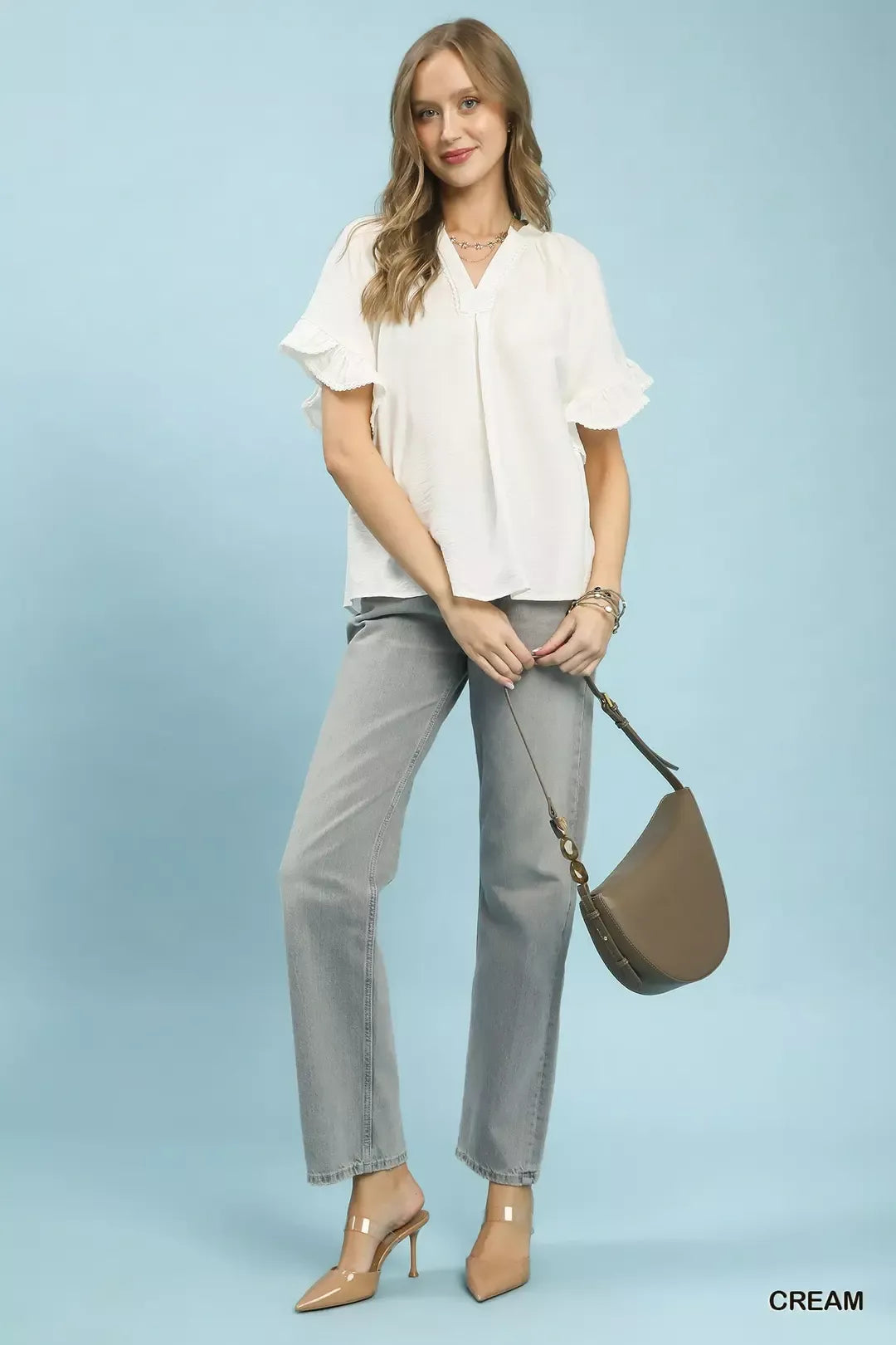 Umgee Ruffle Sleeve V-Neck Flutter Blouse in soft fabric with ruffled sleeves and V-neck design, perfect for casual or dressy wear.