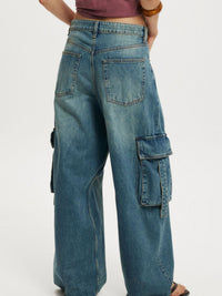 Vintage wash wide leg cargo jeans from Trendsi, showing relaxed fit, multiple pockets, and faded denim fabric.
