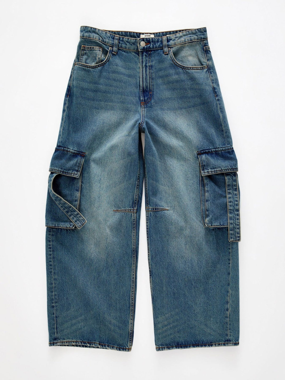 Vintage wash wide leg cargo jeans from Trendsi featuring relaxed fit, multiple pockets, and classic denim styling.