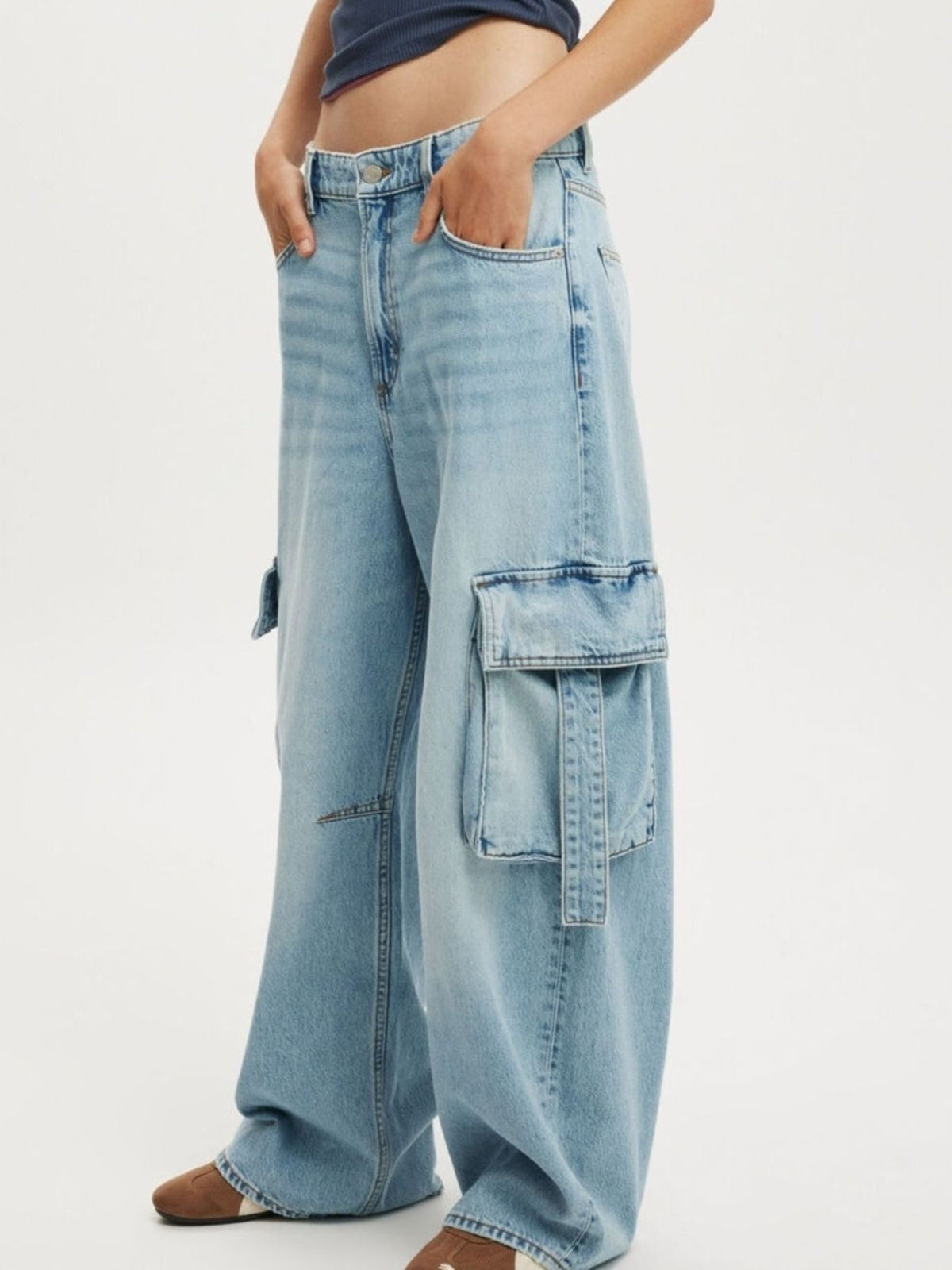 Vintage Wash Wide Leg Cargo Jeans by Trendsi featuring relaxed fit, multiple pockets, and distressed detailing.