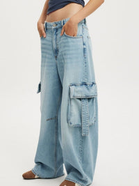 Vintage Wash Wide Leg Cargo Jeans by Trendsi featuring relaxed fit, multiple pockets, and distressed detailing.