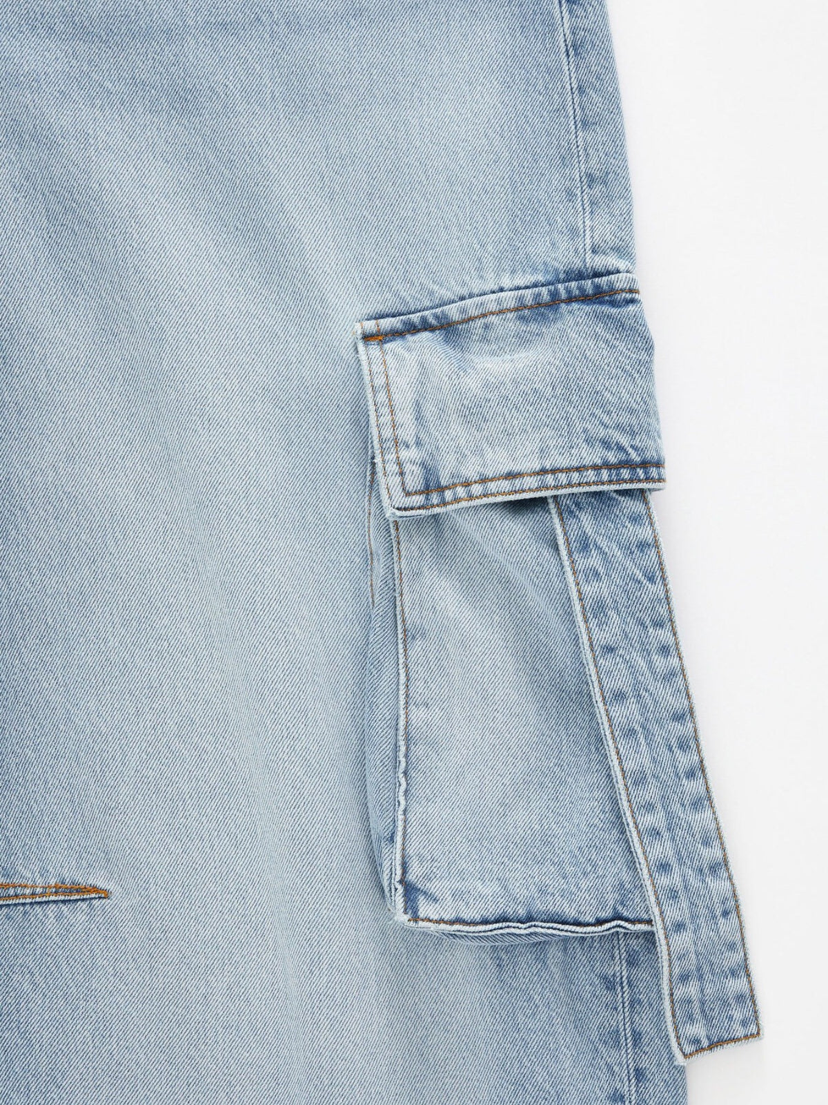 Vintage wash wide-leg cargo jeans from Trendsi featuring relaxed fit, large side pockets, and distressed denim detailing.