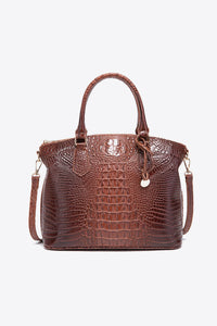 Trendsi PU leather handbag with adjustable strap, top zipper closure, and sleek design, perfect for stylish everyday use.