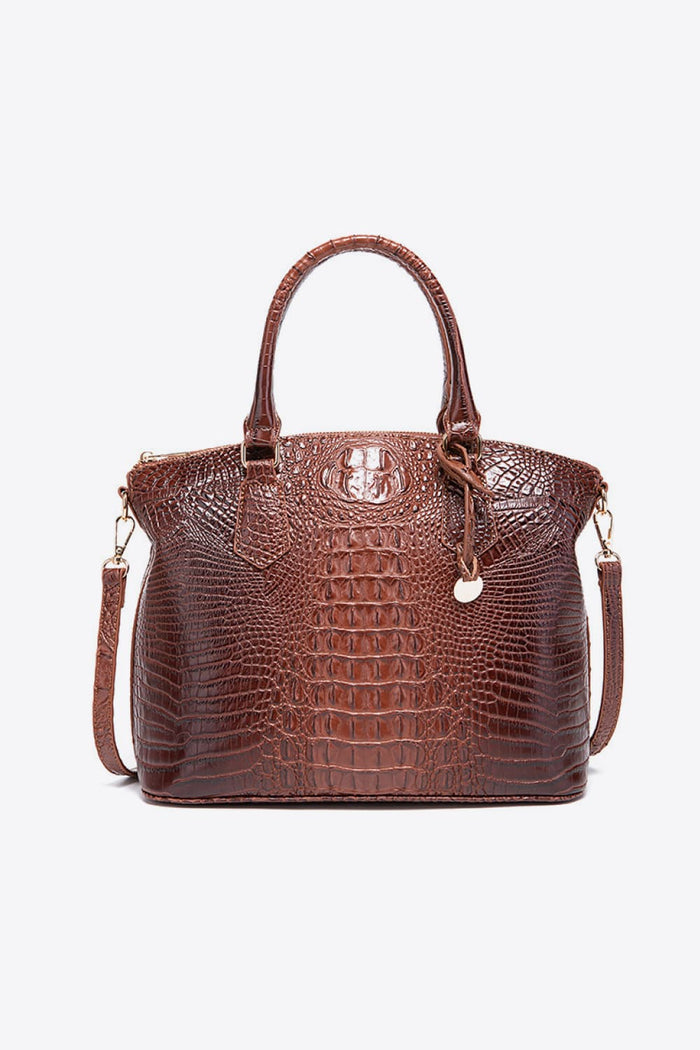Trendsi PU leather handbag with adjustable strap, top zipper closure, and sleek design, perfect for stylish everyday use.