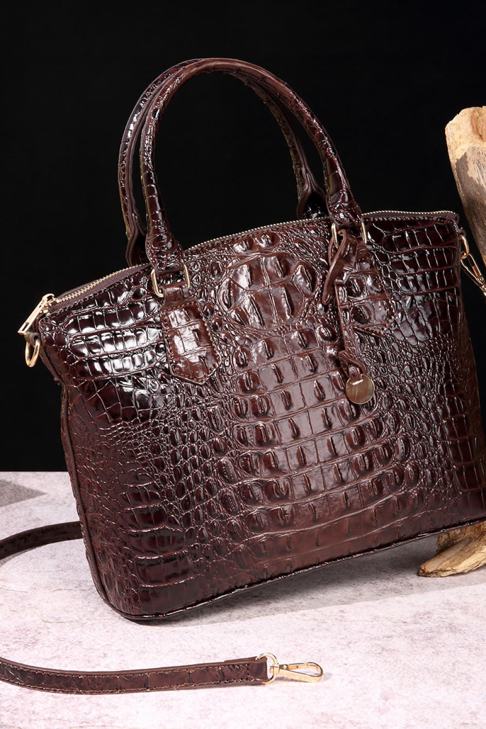 Trendsi PU leather handbag with sleek design, featuring a top handle and adjustable shoulder strap, in a stylish neutral color.