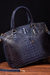 Trendsi PU leather handbag with top handles and gold-tone hardware, showcasing its elegant design and spacious interior.