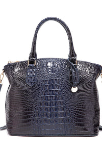 Trendsi PU leather handbag with top handles and sleek design, featuring a smooth surface and structured shape.