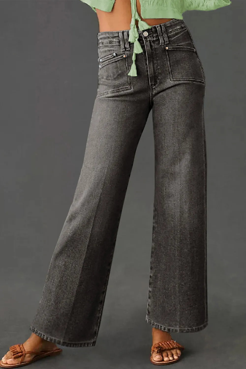 High-waisted wide-leg vintage wash jeans from Trendsi, showing relaxed fit and classic denim style with visible stitching.