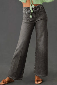 High-waisted wide-leg vintage wash jeans from Trendsi, showing relaxed fit and classic denim style with visible stitching.