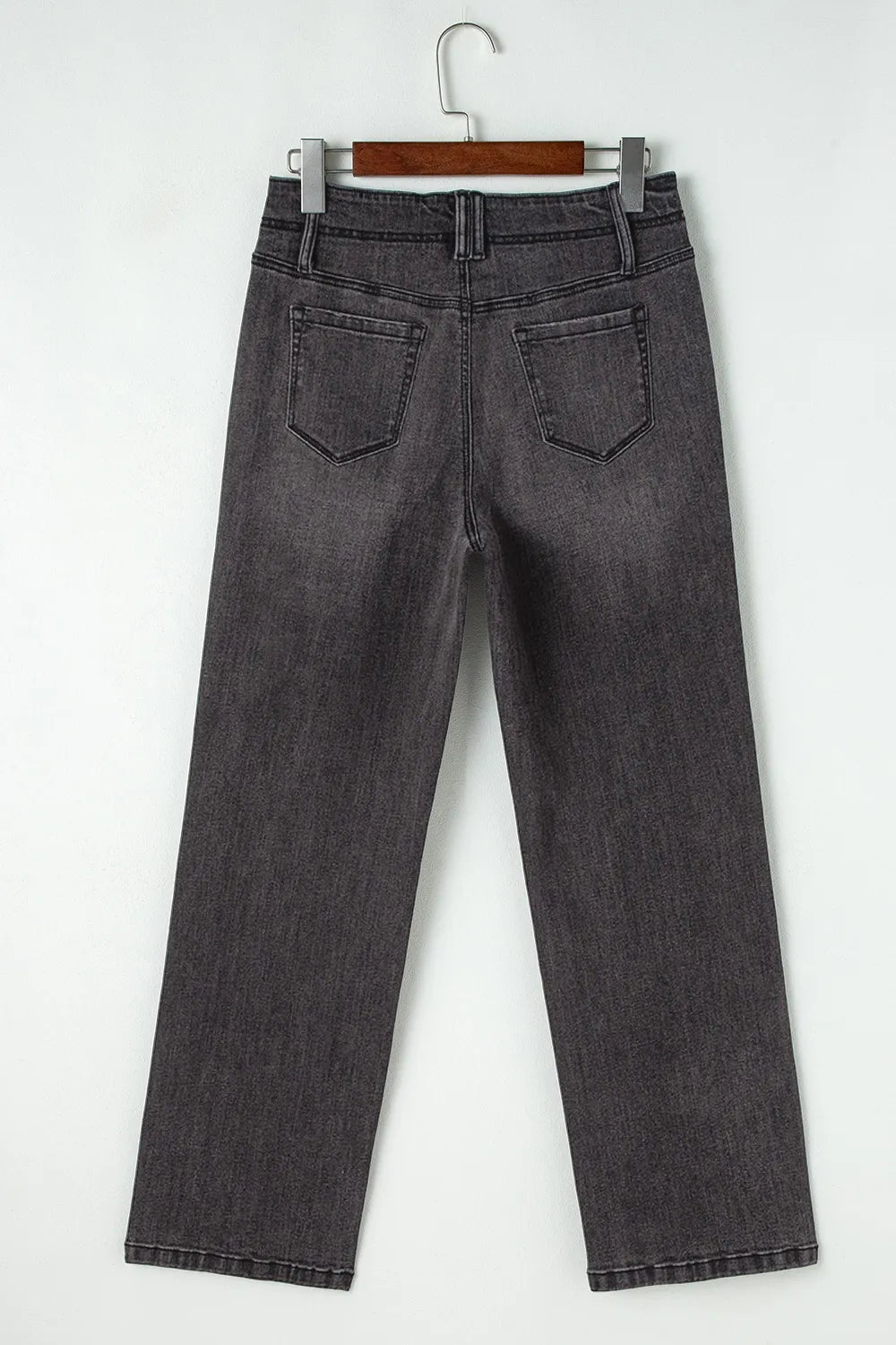 High-waisted wide-leg vintage wash jeans from Trendsi, showing the relaxed fit and faded denim texture.