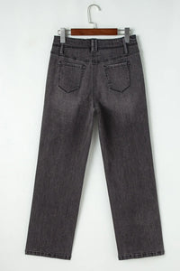 High-waisted wide-leg vintage wash jeans from Trendsi, showing the relaxed fit and faded denim texture.