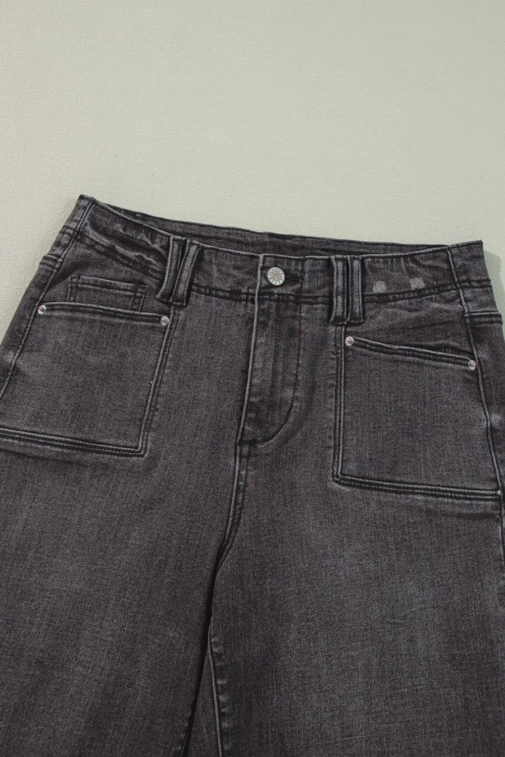 High-waisted wide-leg vintage wash jeans from Trendsi featuring classic denim texture and relaxed fit.