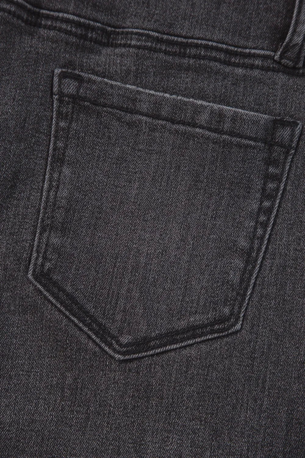 High-waisted vintage wash wide-leg jeans from Trendsi, showing the relaxed fit and classic denim texture.