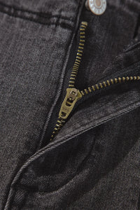 Vintage wash high-waisted wide-leg jeans by Trendsi, showing a relaxed fit with faded denim and classic pocket details.