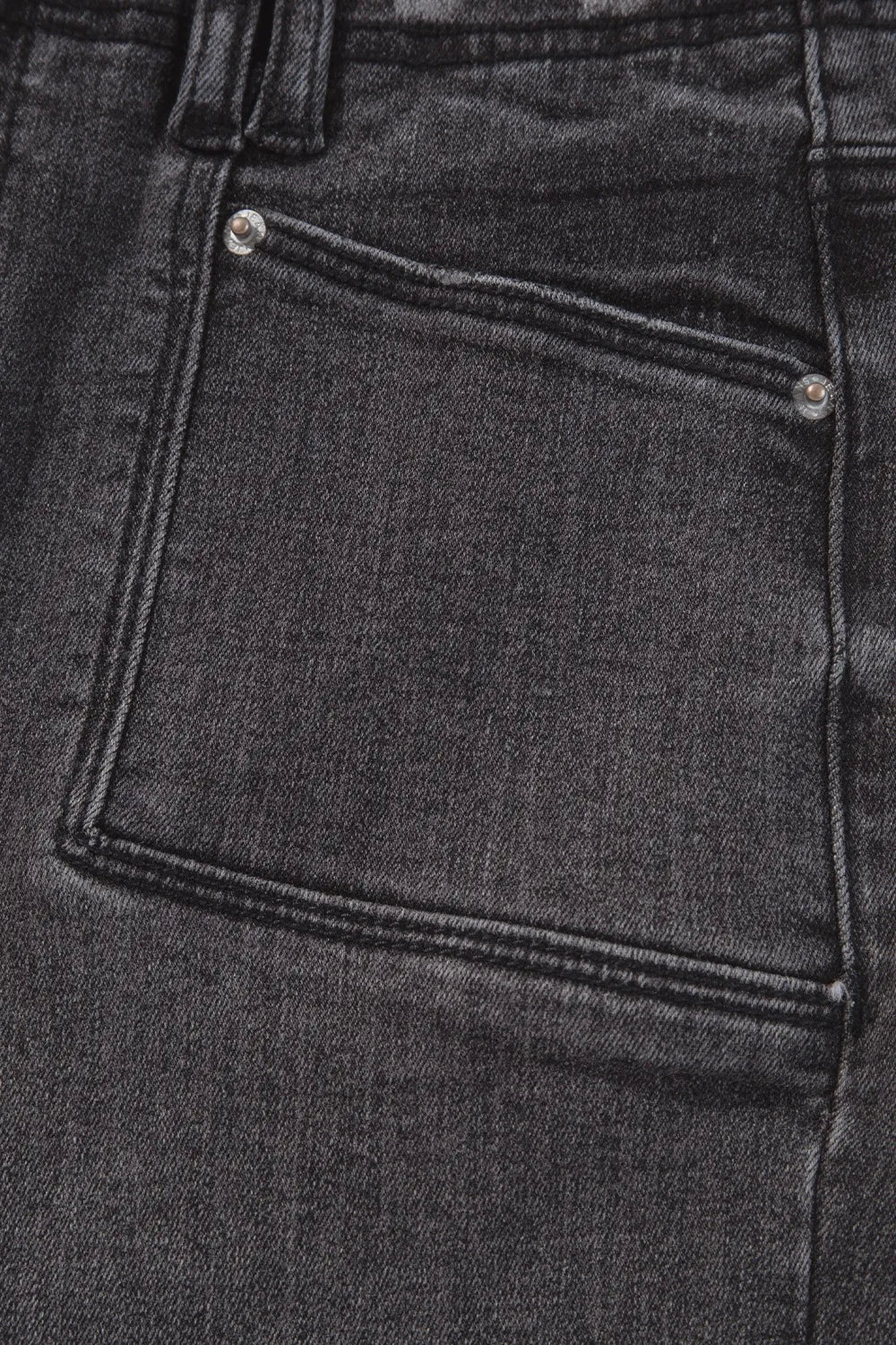 High-waisted wide-leg vintage wash jeans from Trendsi, showing the relaxed fit and faded denim style.