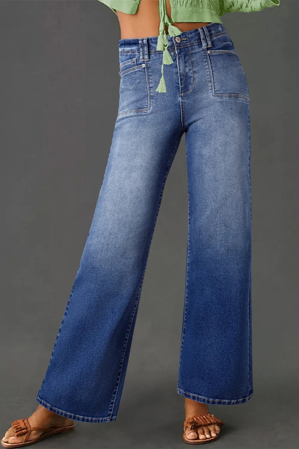 High-waisted vintage wash jeans with wide-leg style from Trendsi, shown on a model, featuring classic denim and relaxed fit.