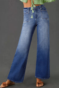 High-waisted vintage wash jeans with wide-leg style from Trendsi, shown on a model, featuring classic denim and relaxed fit.
