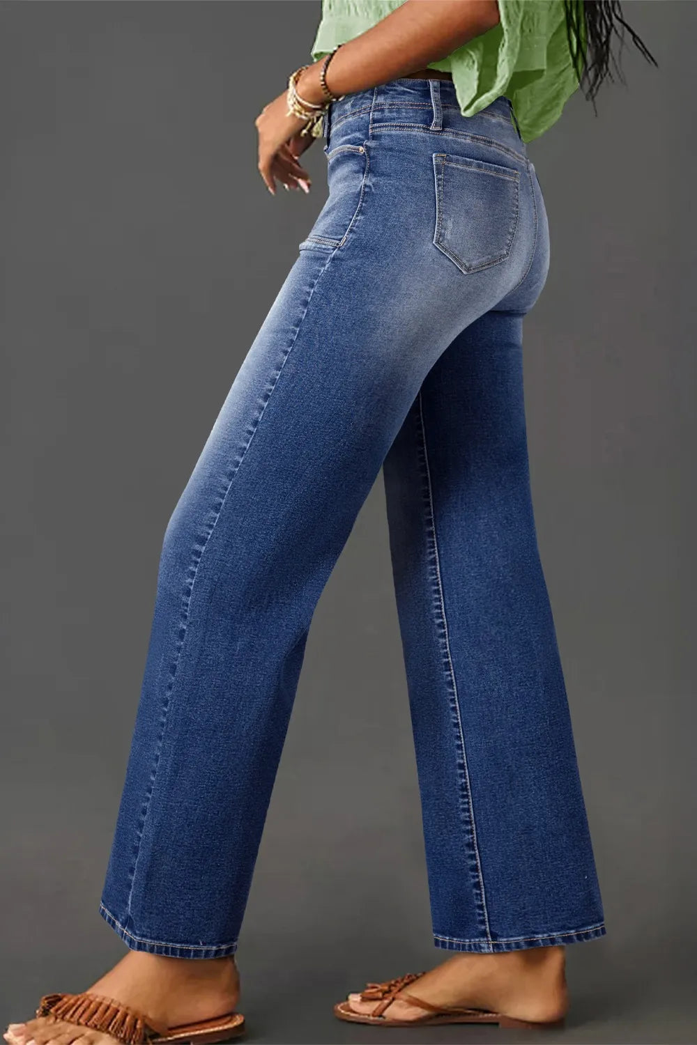 High-waisted wide-leg vintage wash jeans from Trendsi, featuring classic denim style and relaxed fit with faded wash detail.