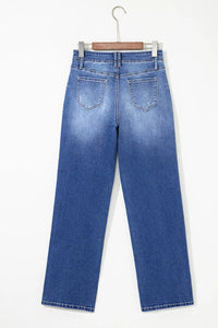 High-waisted wide-leg vintage wash jeans by Trendsi featuring relaxed fit and classic denim style.