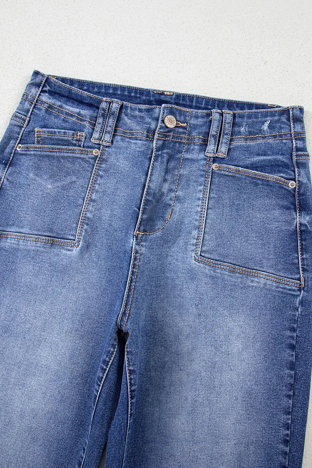 High-waisted wide-leg vintage wash jeans by Trendsi, showcasing classic fit and faded denim style.