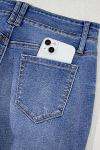 High-waisted vintage wash wide-leg jeans from Trendsi, with classic denim texture and relaxed fit visible in the image.
