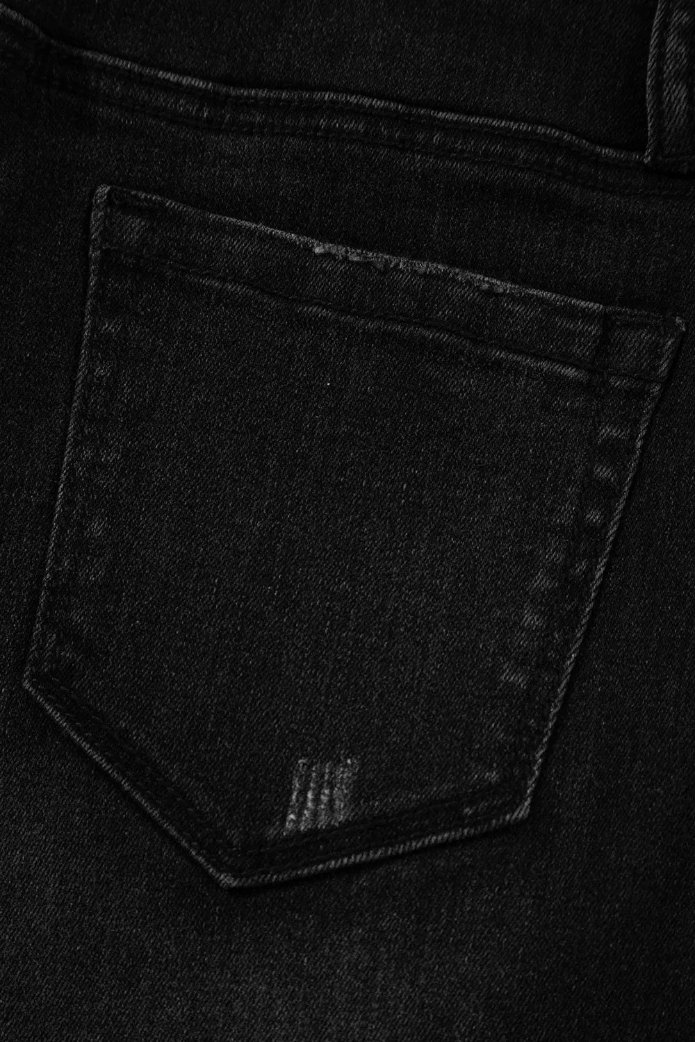 High-waisted wide-leg vintage wash jeans by Trendsi, showing the relaxed fit and classic denim texture.