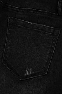 High-waisted wide-leg vintage wash jeans by Trendsi, showing the relaxed fit and classic denim texture.