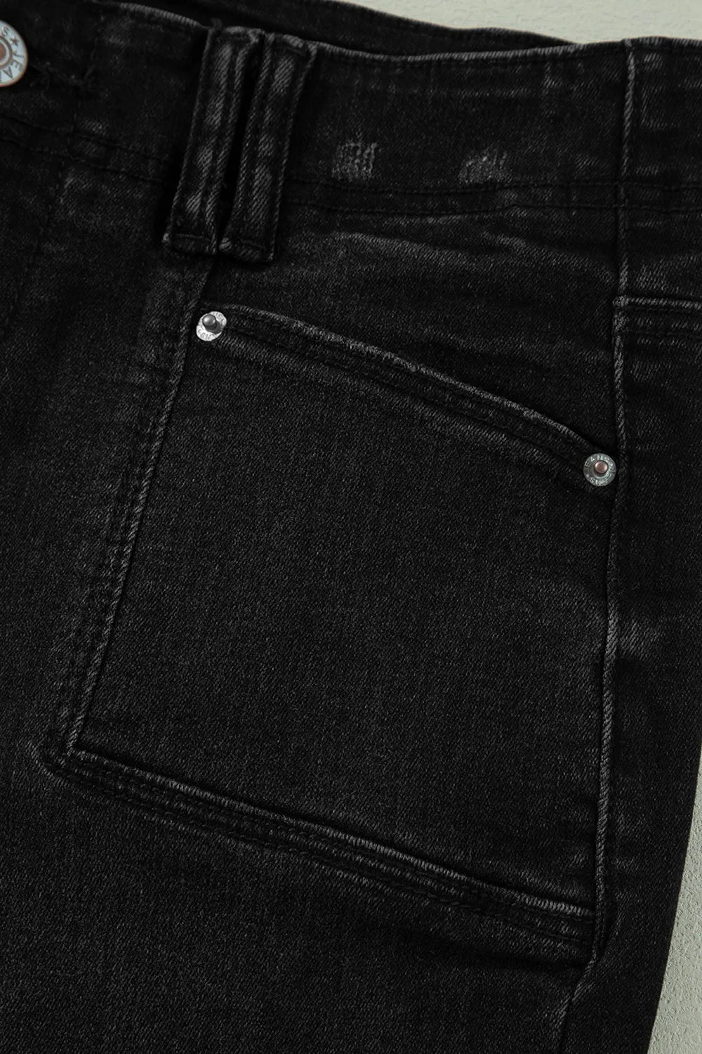 High-waisted wide-leg vintage wash jeans from Trendsi, showcasing relaxed fit and classic denim style with distressed details.