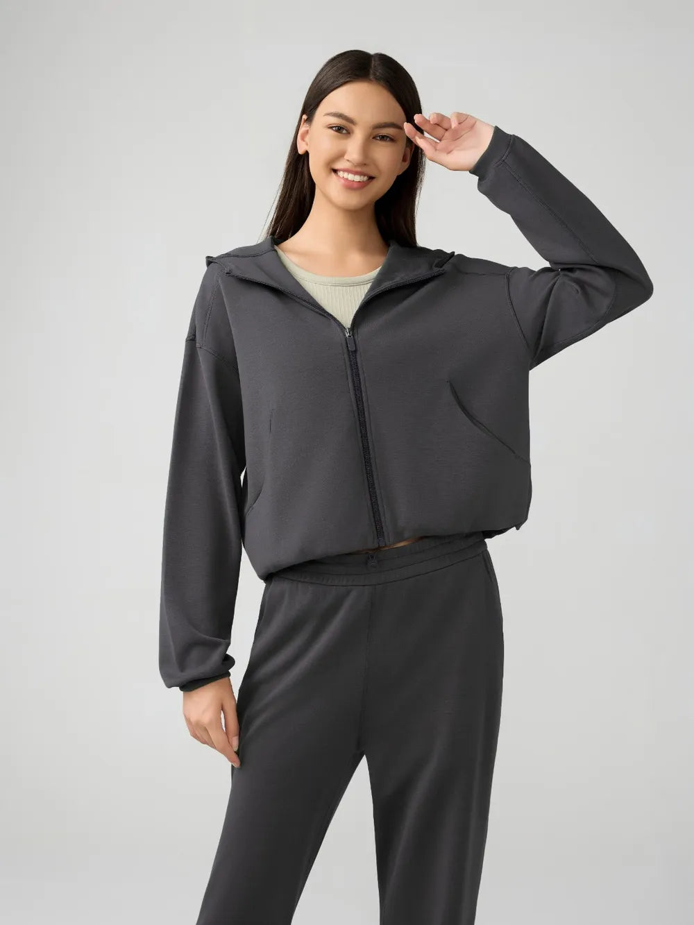 Trendsi Millennia zip-up hoodie with dropped shoulders, active fit, and hood, shown in a stylish, casual design.