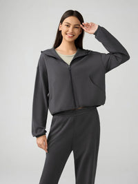 Trendsi Millennia zip-up hoodie with dropped shoulders, active fit, and hood, shown in a stylish, casual design.