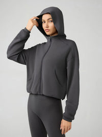 Trendsi Millennia zip-up hoodie with dropped shoulder design, active fit, hood, and full-length zipper, shown in the image.