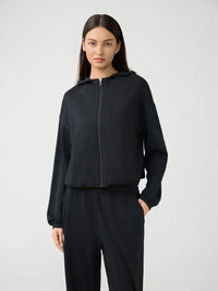 Millennia Zip Up Dropped Shoulder Active Hooded sweatshirt by Trendsi, featuring a zip front, dropped shoulders, and a casual fit.