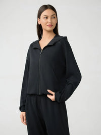 Trendsi Millennia zip-up hoodie with dropped shoulders and active hood, featuring a sleek, modern design and comfortable fit.