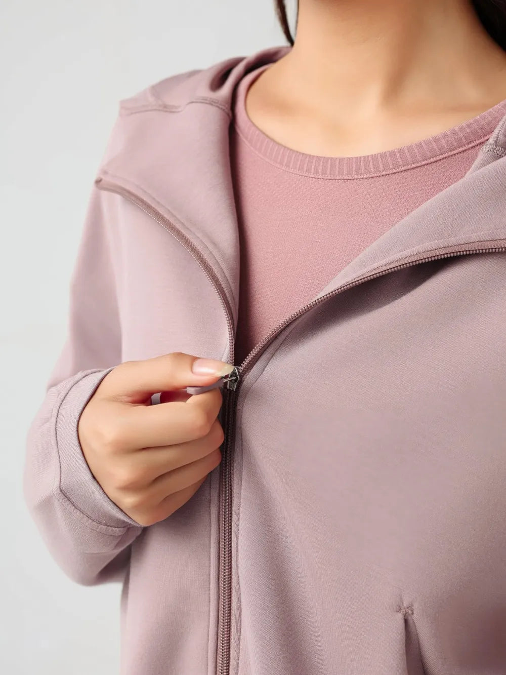 Trendsi Millennia zip-up active hoodie with dropped shoulders and hood, featuring a sleek design and comfortable fit.