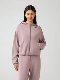 Millennia zip-up dropped shoulder active hoodie by Trendsi, featuring a hood and relaxed fit, shown in a stylish black color.