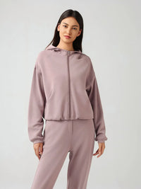 Trendsi Millennia zip-up hoodie with dropped shoulders, active fit, hood, and zip front, shown in a stylish, casual pose.