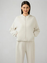 Trendsi Millennia zip-up hoodie with dropped shoulders and active hood, shown in a stylish front view.