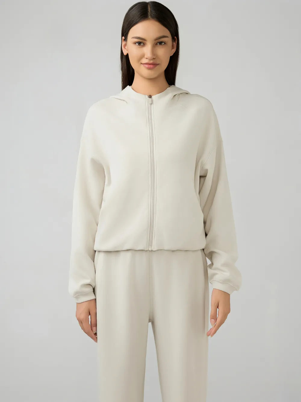 Trendsi Millennia zip-up hoodie with dropped shoulders, active fit, and hood, shown in a stylish, casual design.
