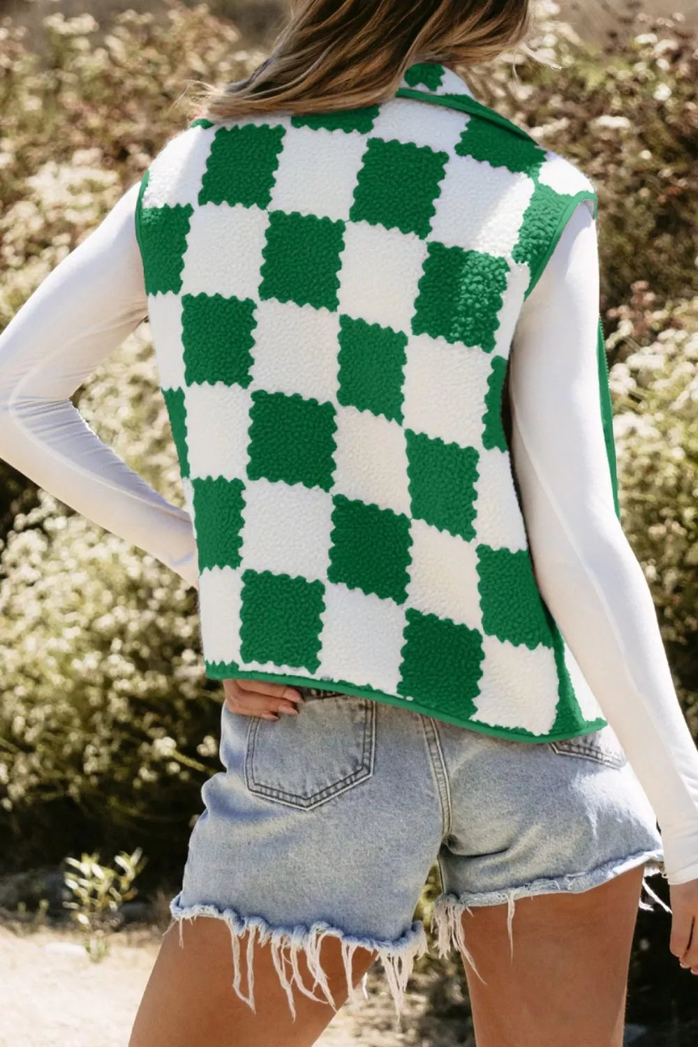 Checkerboard fleece Sherpa vest coat by Trendsi featuring a black and white pattern, cozy fleece material, and a stylish layered look.